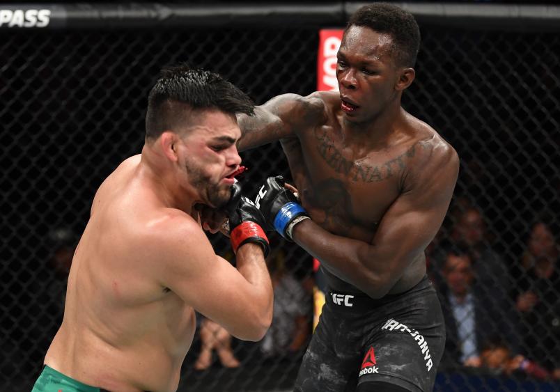 ATLANTA, GA - APRIL 13: (R-L) Israel Adesanya punches Kelvin Gastelum in their interim middleweight championship bout during the UFC 236 event at State Farm Arena on April 13, 2019 in Atlanta, Georgia. (Photo by Josh Hedges/Zuffa LLC/Zuffa LLC via Getty Images)