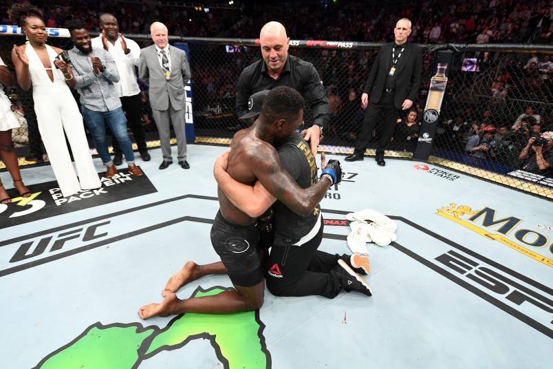 ATLANTA, GA - APRIL 13: Israel Adesanya is embraced by Eugene Bareman after defeating Kelvin Gastelum by unanimous decision in their interim middleweight championship bout during the UFC 236 event in Atlanta, Georgia. (Photo by Josh Hedges/Zuffa LLC)