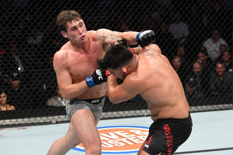 NEW YORK, NEW YORK - NOVEMBER 02: (L-R) Darren Till of England punches Kelvin Gastelum in their middleweight bout during the UFC 244 event at Madison Square Garden on November 02, 2019 in New York City. (Photo by Josh Hedges/Zuffa LLC)