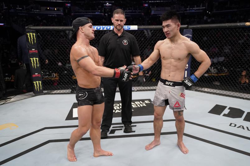 WASHINGTON, DC - DECEMBER 07: (L-R) Cody Stamann and Song Yadong of China react after their bantamweight bout is ruled a majority draw during the UFC Fight Night event at Capital One Arena on December 07, 2019 in Washington, DC. (Photo by Jeff Bottari/Zuffa LLC via Getty Images)