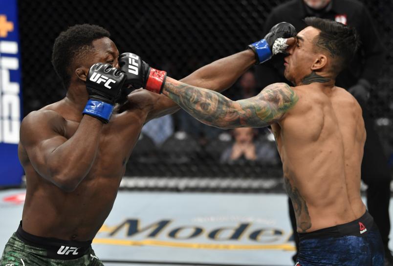 LAS VEGAS, NEVADA - JANUARY 18: (L-R) Ode Osbourne trades punches with Andre Fili in their featherweight fight during the UFC 246 event at T-Mobile Arena on January 18, 2020 in Las Vegas, Nevada. (Photo by Jeff Bottari/Zuffa LLC via Getty Images)