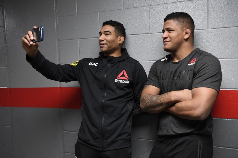 RALEIGH, NORTH CAROLINA - JANUARY 25: (L-R) Herbert Burns of Brazil and Gilbert Burns stand backstage during the UFC Fight Night event at PNC Arena on January 25, 2020 in Raleigh, North Carolina. (Photo by Mike Roach/Zuffa LLC)