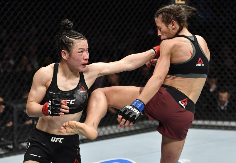 LAS VEGAS, NEVADA - MARCH 07: (R-L) Joanna Jedrzejczyk of Poland and Zhang Weili of China trade strikes in their UFC strawweight championship fight during the UFC 248 event at T-Mobile Arena on March 07, 2020 in Las Vegas, Nevada. (Photo by Jeff Bottari/Zuffa LLC)