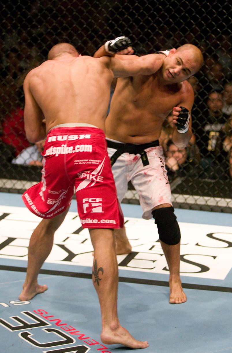 LAS VEGAS, NV - MARCH 04: (R-L) BJ Penn and Georges St-Pierre trade punches during their welterweight bout at UFC 58 at the MGM Grand Garden Arena on March 4, 2006 in Las Vegas, Nevada. (Photo by Josh Hedges/Zuffa LLC/Zuffa LLC via Getty Images)