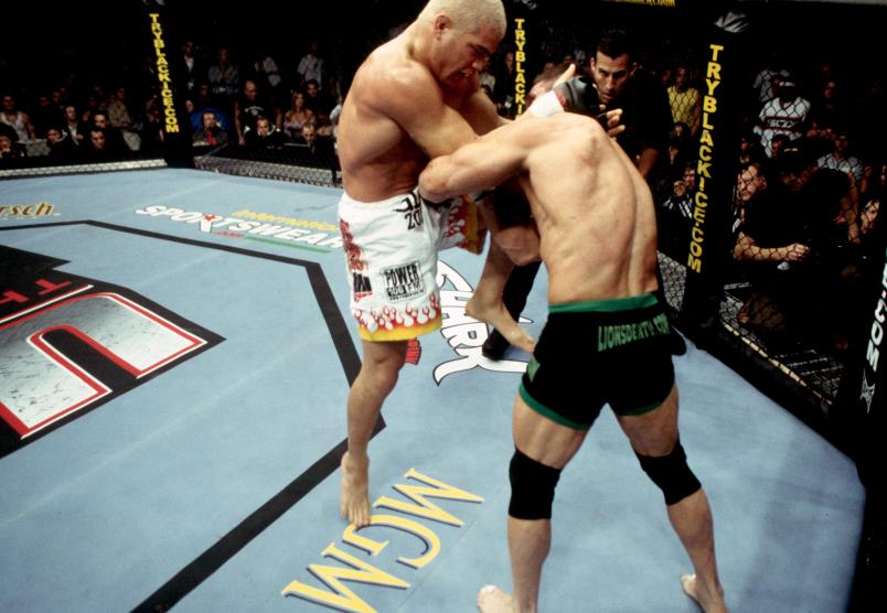 LAS VEGAS, NV - NOVEMBER 22: (L-R) Tito Ortiz knees Ken Shamrock during their light heavyweight championship bout at UFC 40 inside the MGM Grand Garden Arena on November 22, 2002 in Las Vegas, Nevada. (Photo by Josh Hedges/Zuffa LLC/Zuffa LLC via Getty Images)