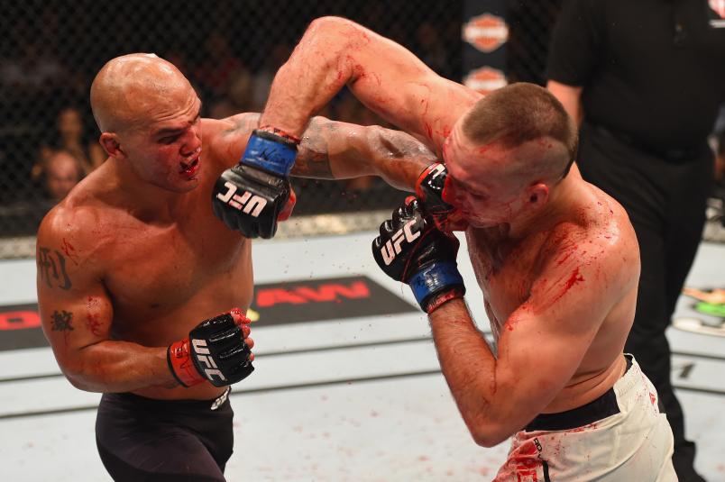 Robbie Lawler punches Rory MacDonald in their UFC welterweight title fight during the UFC 189 event inside MGM Grand Garden Arena on July 11, 2015 in Las Vegas, Nevada. (Photo by Josh Hedges/Zuffa LLC via Getty Images)
