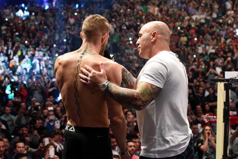 LAS VEGAS, NV - DECEMBER 11: UFC interim featherweight champion Conor McGregor (L) of Ireland is interviewed by Joe Rogan after making weight during the UFC 194 weigh-in inside MGM Grand Garden Arena on December 10, 2015 in Las Vegas, Nevada. (Photo by Mike Roach/Zuffa LLC/Zuffa LLC via Getty Images)