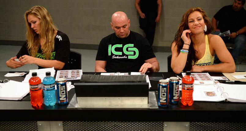 Coach Ronda Rousey, UFC President Dana White and coach Miesha Tate analyze fighters during filming of season eighteen of The Ultimate Fighter on May 29, 2013 in Las Vegas, Nevada. (Photo by Al Powers/Zuffa LLC)