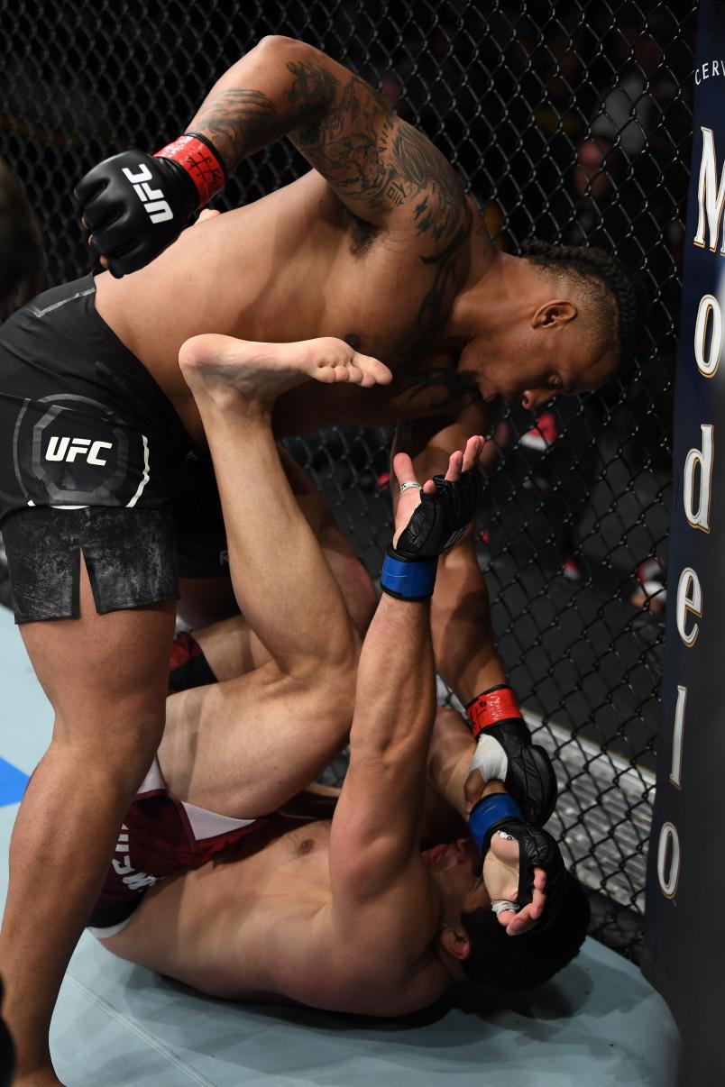SUNRISE, FL - APRIL 27: (L-R) Greg Hardy punches Dmitrii Smoliakov of Russia in their heavyweight bout during the UFC Fight Night event at BB&T Center on April 27, 2019 in Sunrise, Florida. (Photo by Jeff Bottari/Zuffa LLC/Zuffa LLC via Getty Images)