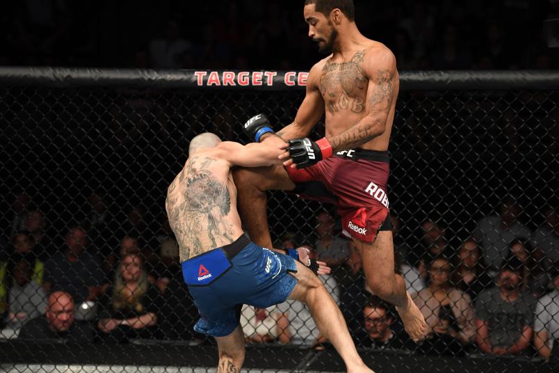 MINNEAPOLIS, MN - JUNE 29: (R-L) Roosevelt Roberts attempts a flying knee against Vinc Pichel in their lightweight bout during the UFC Fight Night event at the Target Center on June 29, 2019 in Minneapolis, Minnesota. (Photo by Josh Hedges/Zuffa LLC/Zuffa LLC via Getty Images)