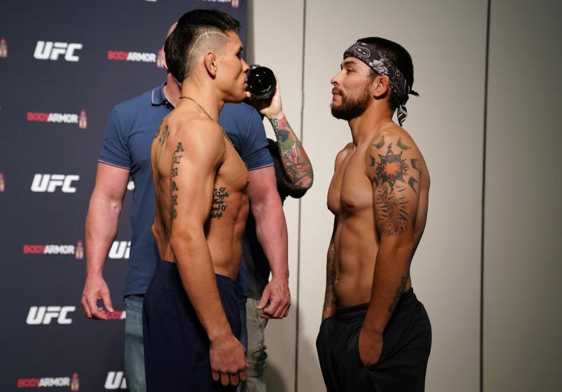 JACKSONVILLE, FLORIDA - MAY 12: (L-R) Opponents Ricky Simon and Ray Borg face off during the official UFC Fight Night weigh-in on May 12, 2020 in Jacksonville, Florida. (Photo by Cooper Neill/Zuffa LLC via Getty Images)