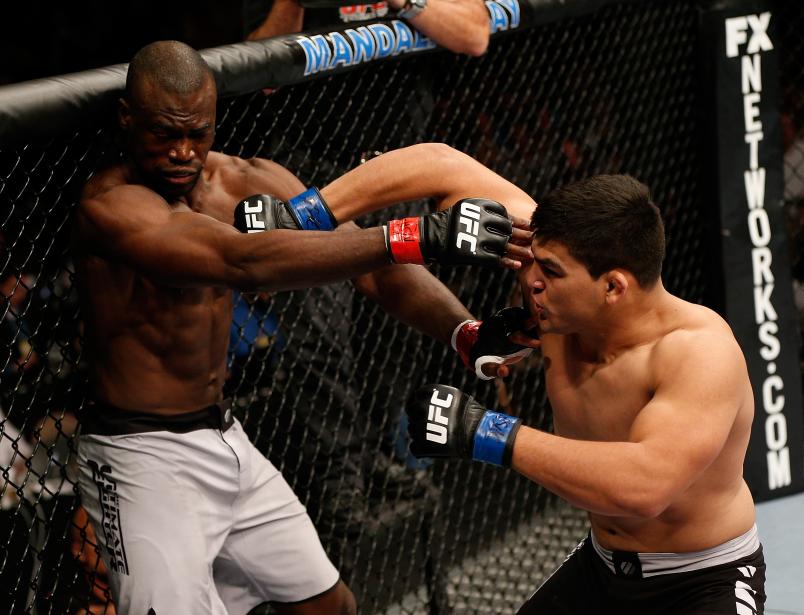 LAS VEGAS, NV - APRIL 13: (R-L) Kelvin Gastelum punches Uriah Hall in their middleweight fight at the Mandalay Bay Events Center on April 13, 2013 in Las Vegas, Nevada. (Photo by Josh Hedges/Zuffa LLC/Zuffa LLC via Getty Images)