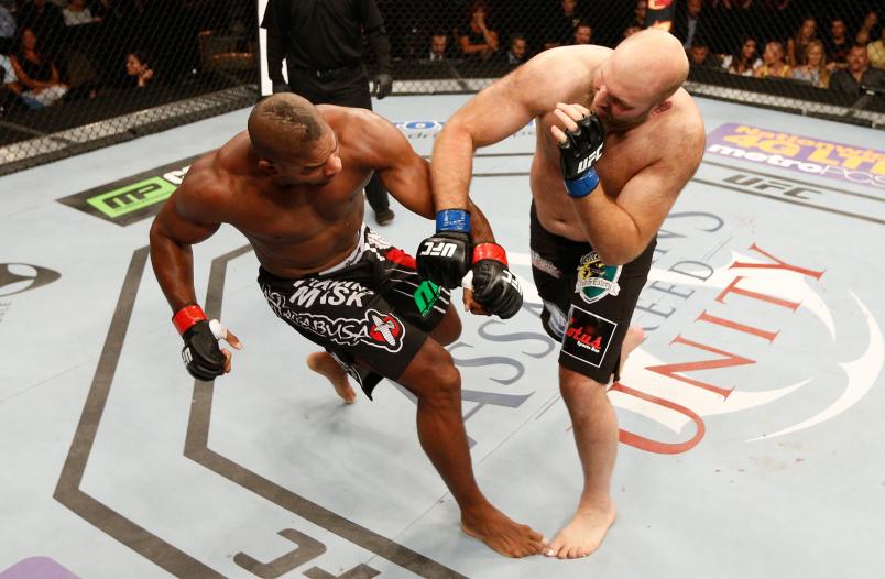 MASHANTUCKET, CT - SEPTEMBER 05: (R-L) Ben Rothwell lands an overhand right to the head of Alistair Overeem in their heavyweight bout during the UFC Fight Night event at Foxwoods Resort Casino on September 5, 2014 in Mashantucket, Connecticut. (Photo by Josh Hedges/Zuffa LLC/Zuffa LLC via Getty Images)