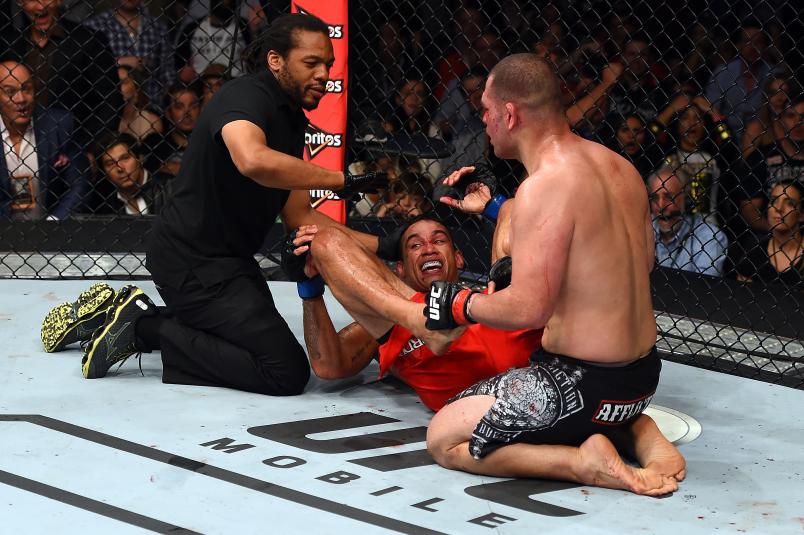 Referee Herb Dean calls a stop to the fight as Fabricio Werdum of Brazil submits Cain Velasquez of the United States in their UFC heavyweight championship bout during the UFC 188 event inside the Arena Ciudad de Mexico on June 13, 2015 in Mexico City, Mexico. (Photo by Josh Hedges/Zuffa LLC via Getty Images)