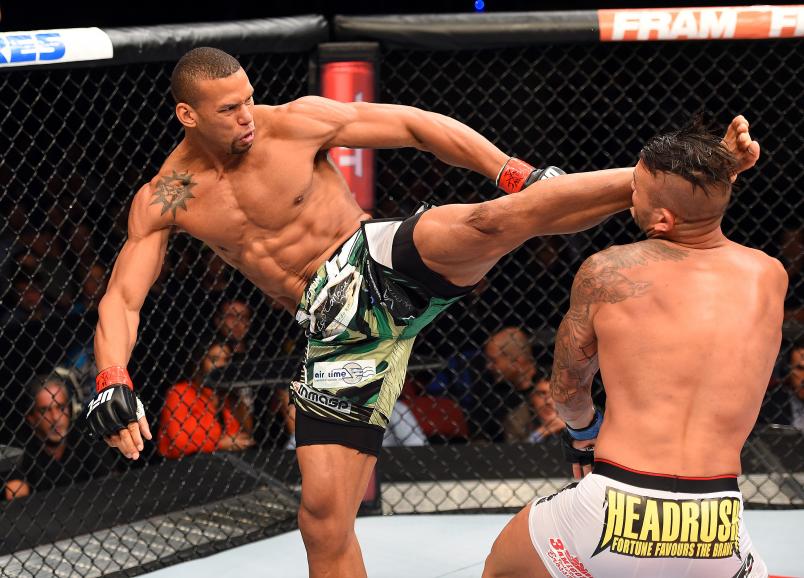 HOLLYWOOD, FL - JUNE 27: (L-R) Thiago Santos of Brazil lands a kick to the head of Steve Bosse of Canada in their middleweight during the UFC Fight Night event at the Hard Rock Live on June 27, 2015 in Hollywood, Florida. (Photo by Josh Hedges/Zuffa LLC)