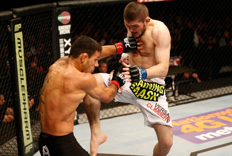 ORLANDO, FL - APRIL 19: (R-L) Khabib Nurmagomedov lands a flying knee against Rafael dos Anjos in their lightweight bout during the FOX UFC Saturday event at the Amway Center on April 19, 2014 in Orlando, Florida. (Photo by Josh Hedges/Zuffa LLC)