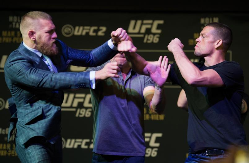 LAS VEGAS, NV - MARCH 3: (L-R) UFC featherweight champion Conor McGregor throws a punch towards Nate Diaz during the UFC 196 Press Conference at David Copperfield Theater in the MGM Grand Hotel/Casino on March 3, 2016 in Las Vegas, Nevada. (Photo by Brandon Magnus/Zuffa LLC/Zuffa LLC via Getty Images)