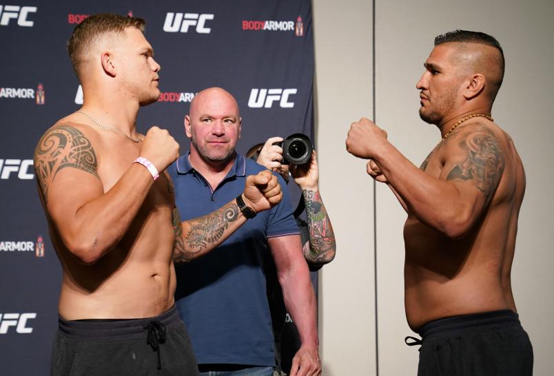 (L-R) Opponents Chase Sherman and Ike Villanueva face off during the official UFC Fight Night weigh-in on May 12, 2020 in Jacksonville, Florida. (Photo by Cooper Neill/Zuffa LLC)