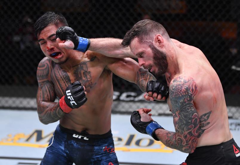 Tony Kelley and Kai Kamaka trade punches in their featherweight bout during the UFC 252 event at UFC APEX on August 15, 2020 in Las Vegas, Nevada. (Photo by Jeff Bottari/Zuffa LLC)