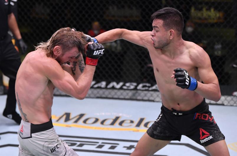 Royval punches Tim Elliott in their flyweight fight during the UFC Fight Night event at UFC APEX on May 30, 2020 in Las Vegas, Nevada. (Photo by Jeff Bottari/Zuffa LLC)