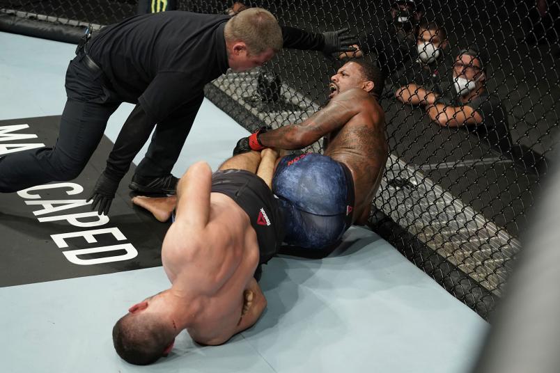 Thiago Moises of Brazil submits Michael Johnson in their lightweight bout during the UFC Fight Night Event at VyStar Veterans Memorial Arena on May 13, 2020 in Jacksonville, Florida. (Photo by Cooper Neill/Zuffa LLC)