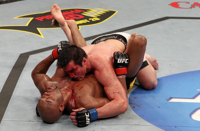 Chael Sonnen and Anderson Silva grapple during the UFC Middleweight Championship bout at Oracle Arena on August 7, 2010 in Oakland, California. (Photo by Josh Hedges/Zuffa LLC via Getty Images)