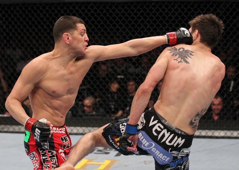 LAS VEGAS, NV - FEBRUARY 04: (L-R) Nick Diaz punches Carlos Condit during the UFC 143 event at Mandalay Bay Events Center on February 4, 2012 in Las Vegas, Nevada. (Photo by Nick Laham/Zuffa LLC/Zuffa LLC via Getty Images)