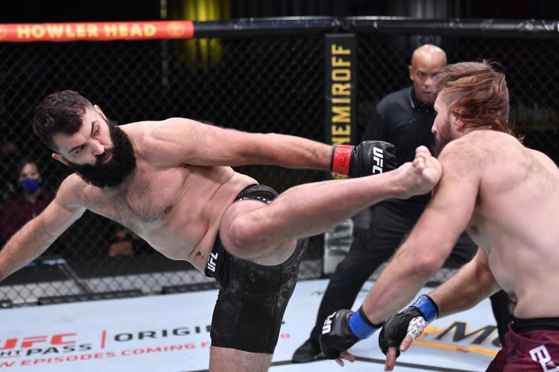Andrei Arlovski (L) of Belarus kicks Tanner Boser of Canada in a heavyweight fight during the UFC Fight Night event at UFC APEX on November 07, 2020 in Las Vegas, Nevada. (Photo by Jeff Bottari/Zuffa LLC via Getty Images)