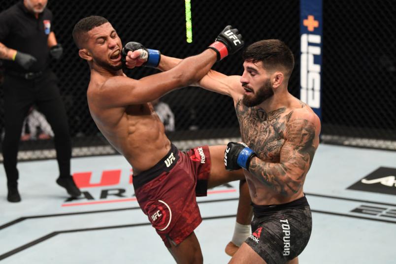 ABU DHABI, UNITED ARAB EMIRATES - OCTOBER 11: (R-L) Ilia Topuria punches Youssef Zalal of Morocco in their featherweight bout during the UFC Fight Night event inside Flash Forum on UFC Fight Island on October 11, 2020 in Abu Dhabi, United Arab Emirates. (Photo by Josh Hedges/Zuffa LLC)
