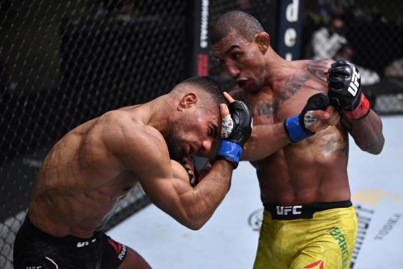 Raoni Barcelos of Brazil punches Khalid Taha of Germany in a bantamweight fight during the UFC Fight Night event at UFC APEX on November 07, 2020 in Las Vegas, Nevada. (Photo by Jeff Bottari/Zuffa LLC)