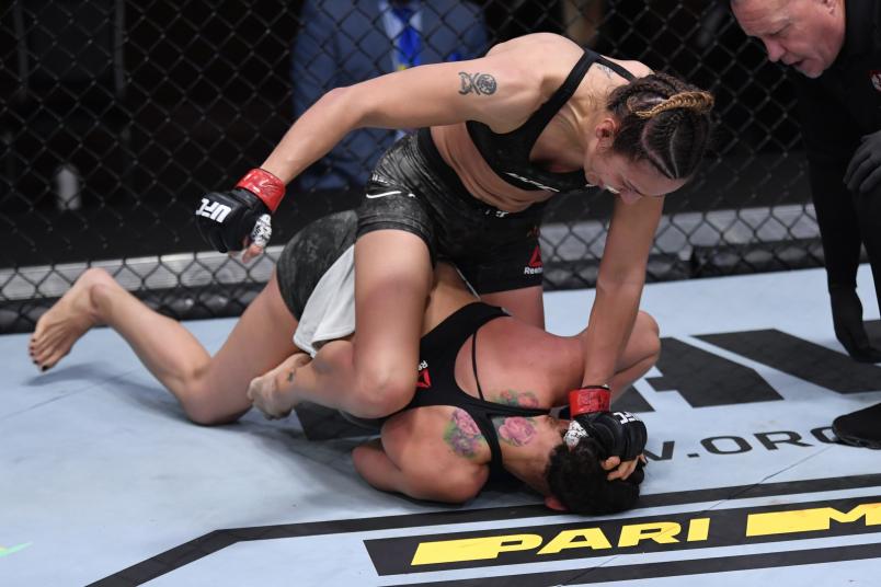 Antonina Shevchenko of Kyrgyzstan (top) punches Ariane Lipski of Brazil in their women's flyweight bout during the UFC 255 event at UFC APEX on November 21, 2020 in Las Vegas, Nevada. (Photo by Jeff Bottari/Zuffa LLC)