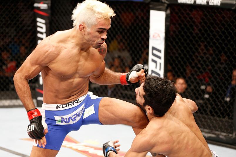 Godofredo "Pepey" Castro knocks out Noad Lahat with a flying knee in their featherweight bout during the UFC Fight Night event at Ginasio Nelio Dias on March 23, 2014 in Natal, Brazil. (Photo by Josh Hedges/Zuffa LLC via Getty Images)