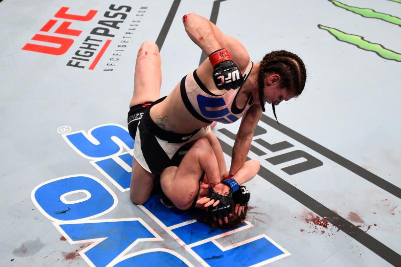 Lauren Murphy (top) punches Faszholz in their women's bantamweight bout during the UFC Fight Night event at Consol Energy Center on February 21, 2016 in Pittsburgh, Pennsylvania. (Photo by Jeff Bottari/Zuffa LLC via Getty Images)