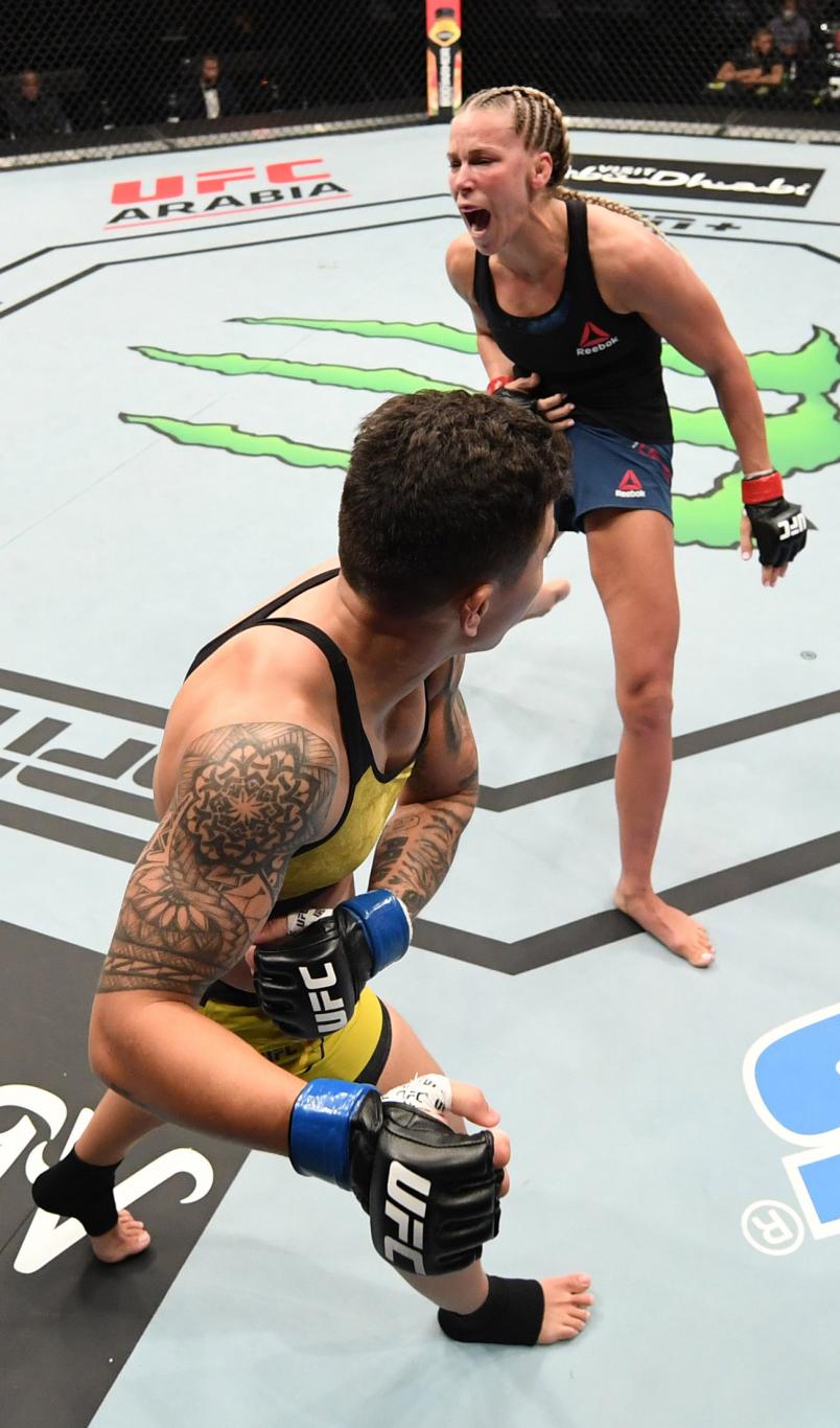 Jessica Andrade of Brazil hurts the body of Katlyn Chookagian in their women's flyweight bout during the UFC Fight Night event inside Flash Forum on UFC Fight Island on October 18, 2020 in Abu Dhabi, United Arab Emirates. (Photo by Josh Hedges/Zuffa LLC)