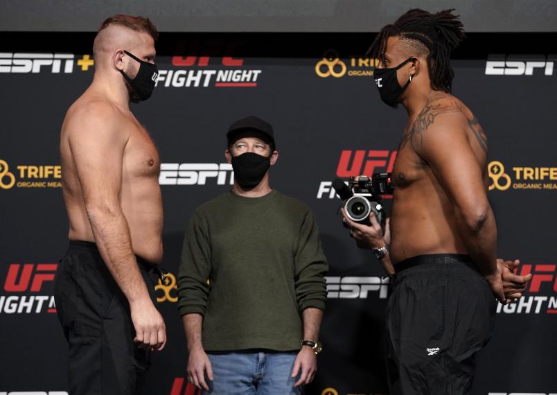 Marcin Tybura of Poland and Greg Hardy face off during the UFC Fight Night weigh-in at UFC APEX on December 18, 2020 in Las Vegas, Nevada. (Photo by Cooper Neill/Zuffa LLC)