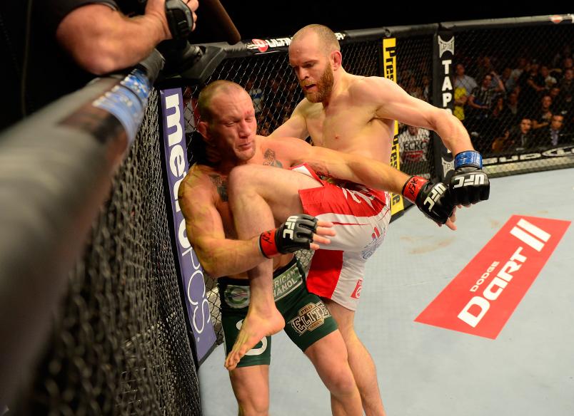 T.J. Grant knees Gray Maynard in their lightweight bout during UFC 160 at the MGM Grand Garden Arena on May 25, 2013 in Las Vegas, Nevada. (Photo by Donald Miralle/Zuffa LLC)