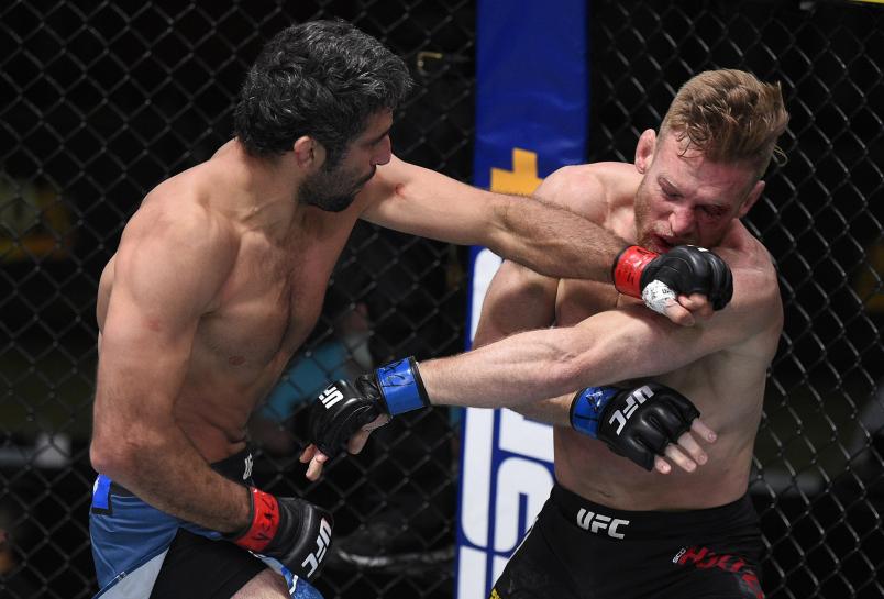 Beneil Dariush of Iran punches Scott Holtzman in their lightweight fight during the UFC Fight Night event at UFC APEX on August 08, 2020 in Las Vegas, Nevada. (Photo by Chris Unger/Zuffa LLC)