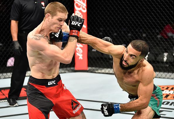 Belal Muhammad punches Jordan Mein in their welterweight bout during the UFC 213 event at T-Mobile Arena on July 8, 2017 in Las Vegas, Nevada. (Photo by Jeff Bottari/Zuffa LLC)
