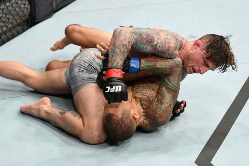 Gregor Gillespie (top) punches Yancy Medeiros in their lightweight bout during the UFC Fight Night event at the Barclays Center on January 19, 2019 in the Brooklyn borough of New York City. (Photo by Josh Hedges/Zuffa LLC)