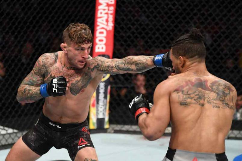 Gregor Gillespie punches Kevin Lee in their lightweight bout during the UFC 244 event at Madison Square Garden on November 02, 2019 in New York City. (Photo by Josh Hedges/Zuffa LLC)