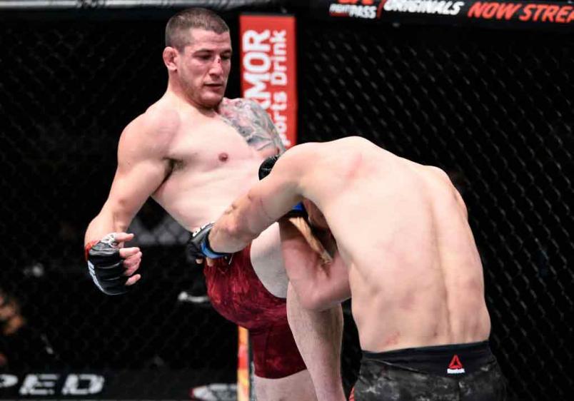 Marc-Andre Barriault of Canada knees Oskar Piechota of Poland in their middleweight bout during the UFC Fight Night event at UFC APEX on June 20, 2020 in Las Vegas, Nevada. (Photo by Chris Unger/Zuffa LLC)