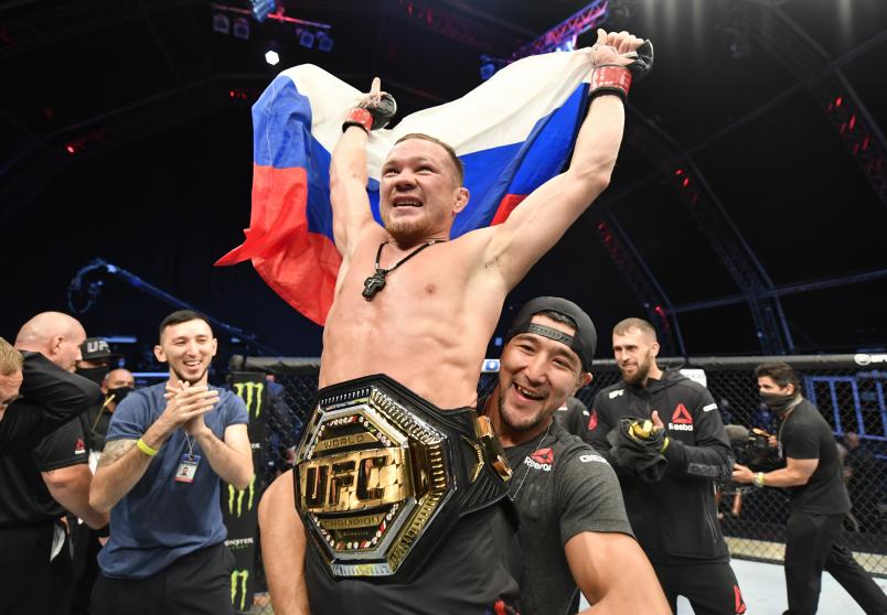Petr Yan of Russia celebrates after his TKO victory over Jose Aldo in their UFC bantamweight championship fight during the UFC 251 event at Flash Forum on UFC Fight Island on July 12, 2020 on Yas Island, Abu Dhabi, United Arab Emirates. (Photo by Jeff Bottari/Zuffa LLC)