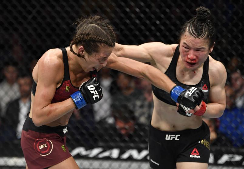 Joanna Jedrzejczyk of Poland punches Zhang Weili of China in their UFC strawweight championship fight during the UFC 248 event at T-Mobile Arena on March 07, 2020 in Las Vegas, Nevada. (Photo by Jeff Bottari/Zuffa LLC)
