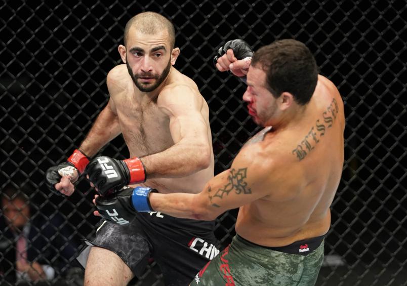 Giga Chikadze of Georgia punches Irwin Rivera of Mexico in their featherweight fight during the UFC Fight Night event at VyStar Veterans Memorial Arena on May 16, 2020 in Jacksonville, Florida. (Photo by Cooper Neill/Zuffa LLC via Getty Images)