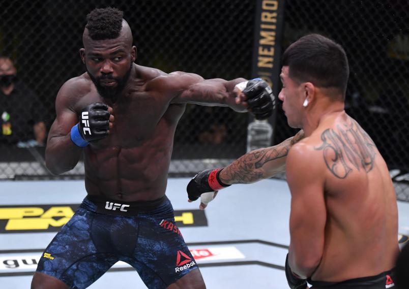 Impa Kasanganay punches Maki Pitolo in their middleweight fight during the UFC Fight Night event at UFC APEX on August 29, 2020 in Las Vegas, Nevada. (Photo by Jeff Bottari/Zuffa LLC)