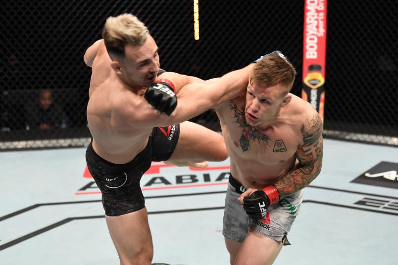 Jimmy Crute of Australia punches Modestas Bukauskas of Lithuania in their light heavyweight bout during the UFC Fight Night event inside Flash Forum on UFC Fight Island on October 18, 2020 in Abu Dhabi, United Arab Emirates. (Photo by Josh Hedges/Zuffa LLC)