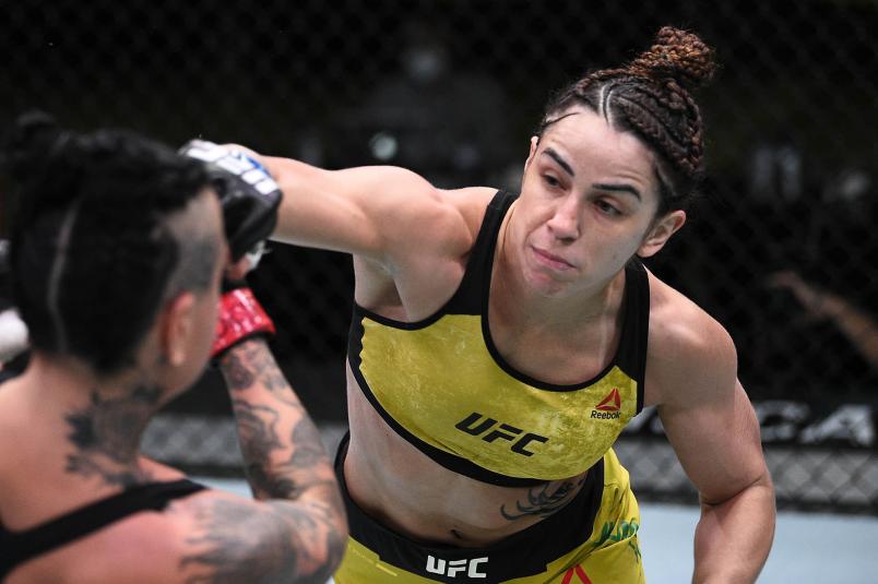 Norma Dumont of Brazil punches Ashlee Evans-Smith in their women's bantamweight bout during the UFC Fight Night at UFC APEX on November 28, 2020 in Las Vegas, Nevada. (Photo by Chris Unger/Zuffa LLC)