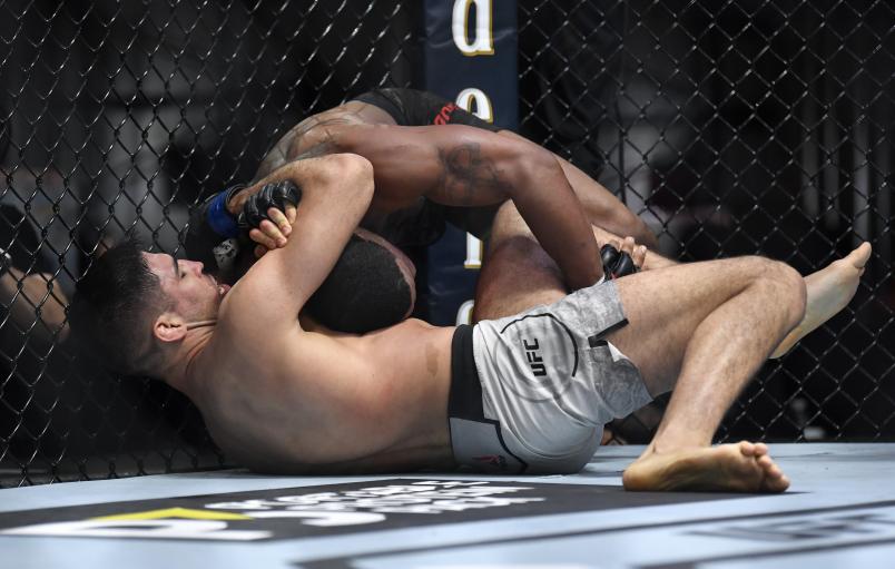 Vicente Luque secures a submission against Tyron Woodley in their welterweight fight during the UFC 260 event at UFC APEX on March 27, 2021 in Las Vegas, Nevada. (Photo by Chris Unger/Zuffa LLC)