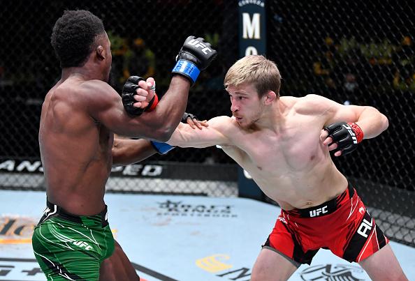Arnold Allen of England punches Sodiq Yusuff of Nigeria in a featherweight fight during the UFC Fight Night event at UFC APEX on April 10, 2021 in Las Vegas, Nevada. (Photo by Chris Unger/Zuffa LLC)