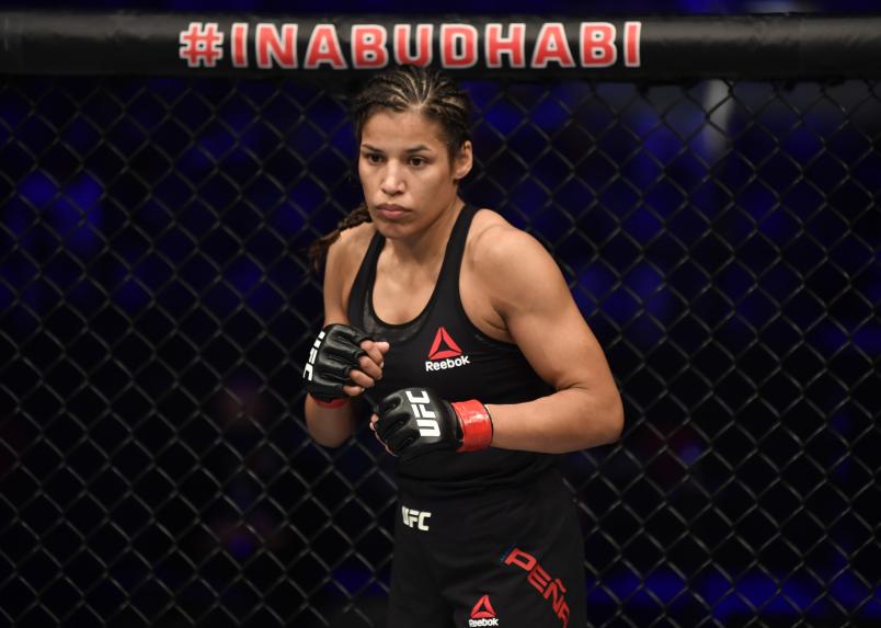 Julianna Pena battles Sara McMann in a bantamweight fight during the UFC 257 event inside Etihad Arena on UFC Fight Island on January 23, 2021 in Abu Dhabi, United Arab Emirates. (Photo by Jeff Bottari/Zuffa LLC)